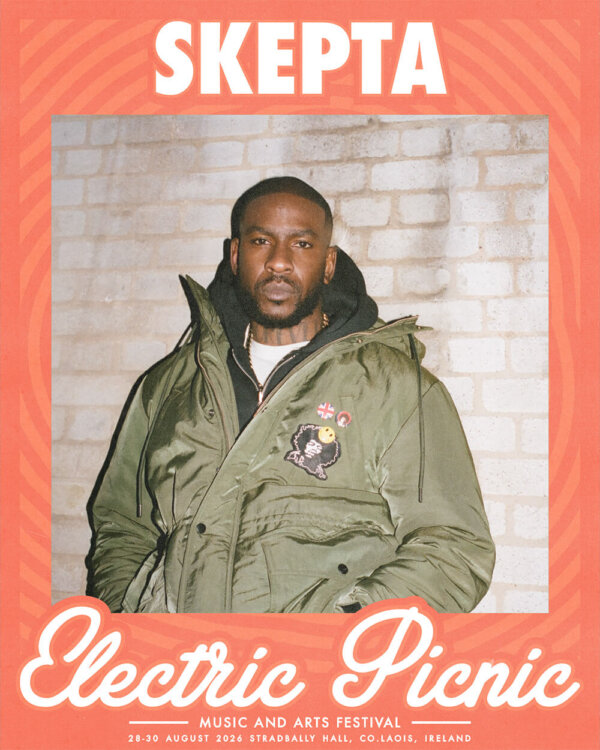 Skepta against a brick wall wearing a coat - Electric Picnic Logo